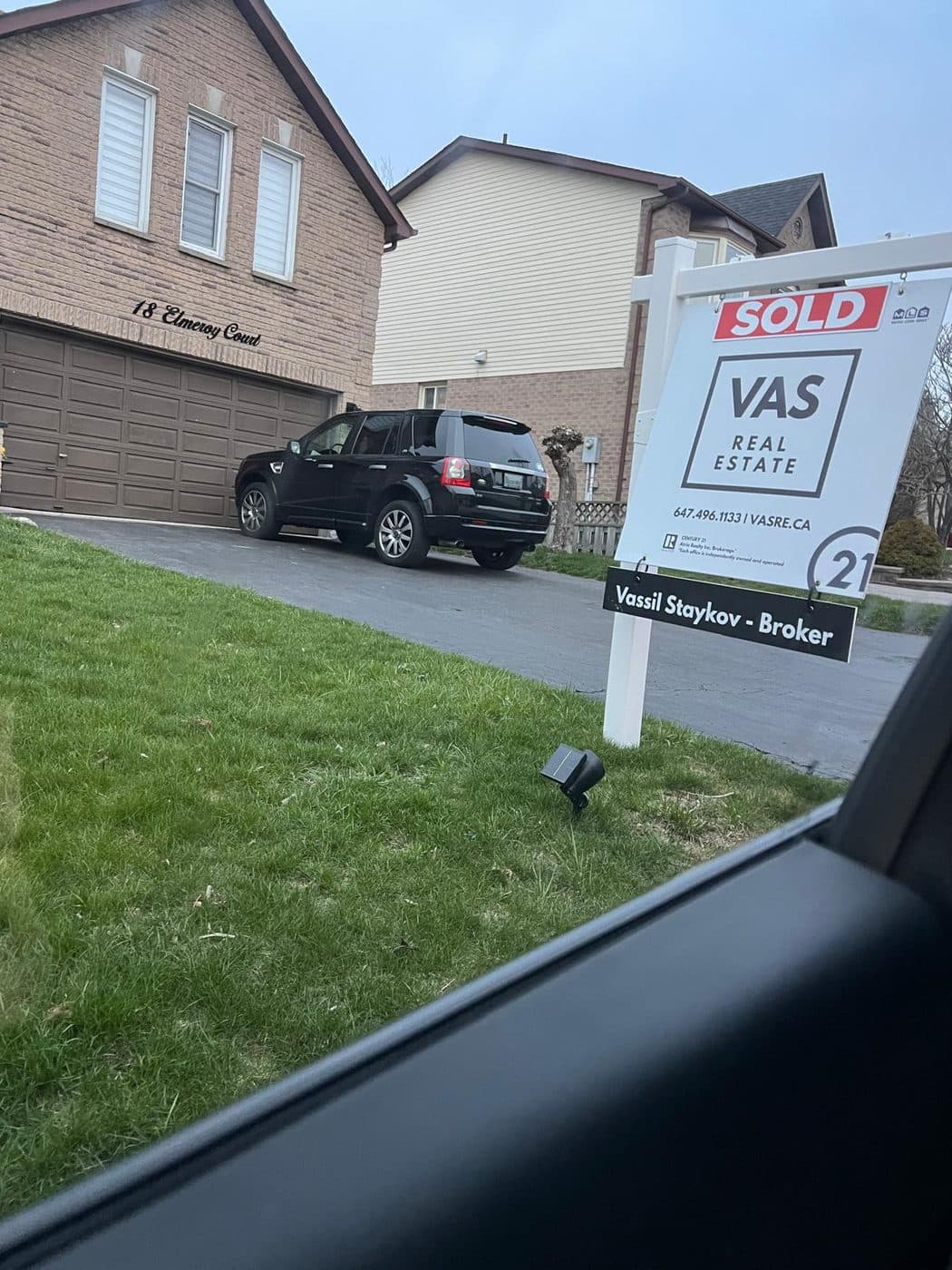 A VAS Real Estate sold sign outside a Markham home