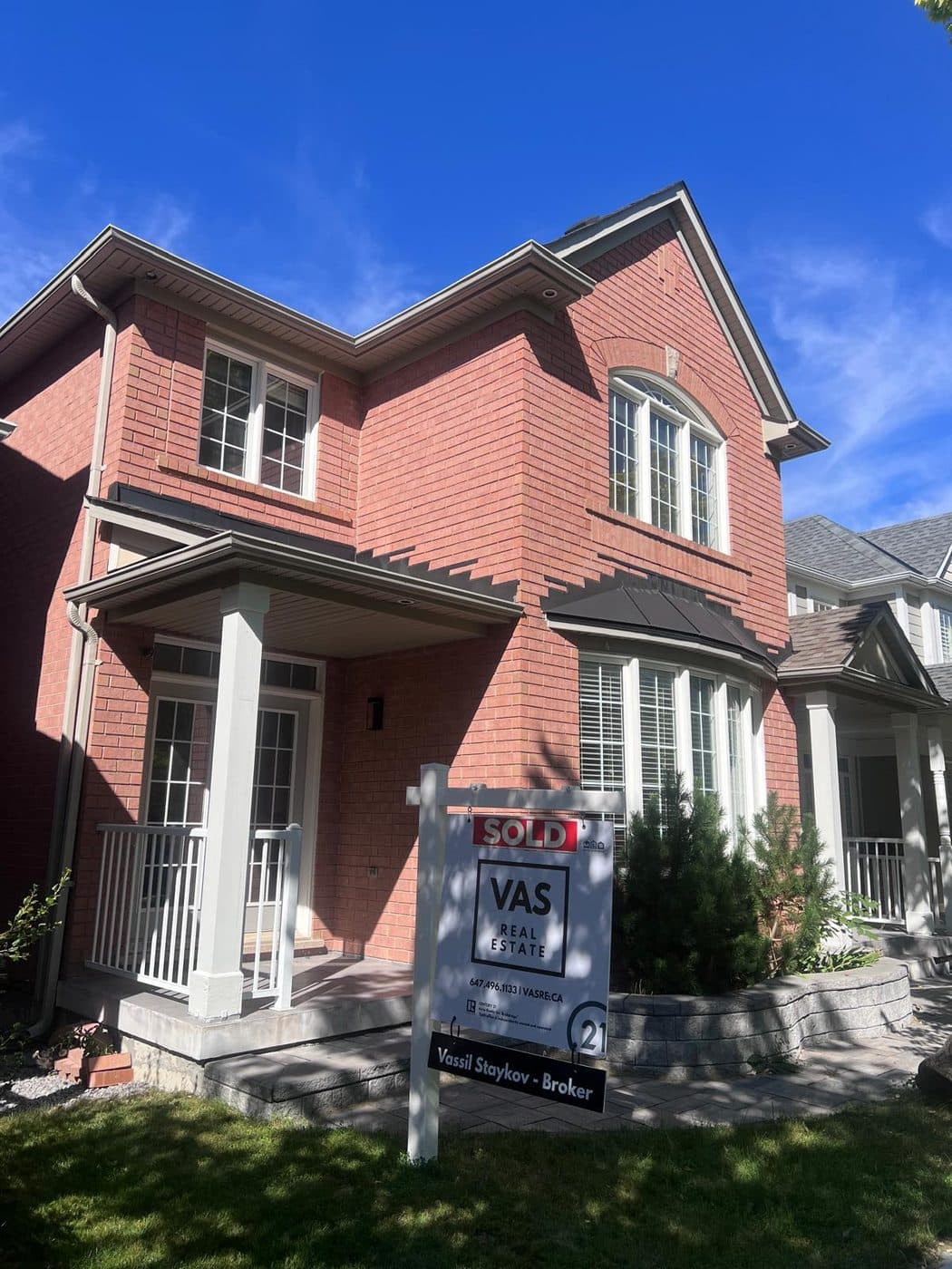 A VAS Real Estate sold sign outside a Markham home